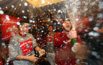 ST LOUIS, MO - OCTOBER 28: Yadier Molina #4 of the St. Louis Cardinals celebrates in the locker room after defeating the Texas Rangers 6-2 to win Game Seven of the MLB World Series at Busch Stadium on October 28, 2011 in St Louis, Missouri. (Photo by Jamie Squire/Getty Images)