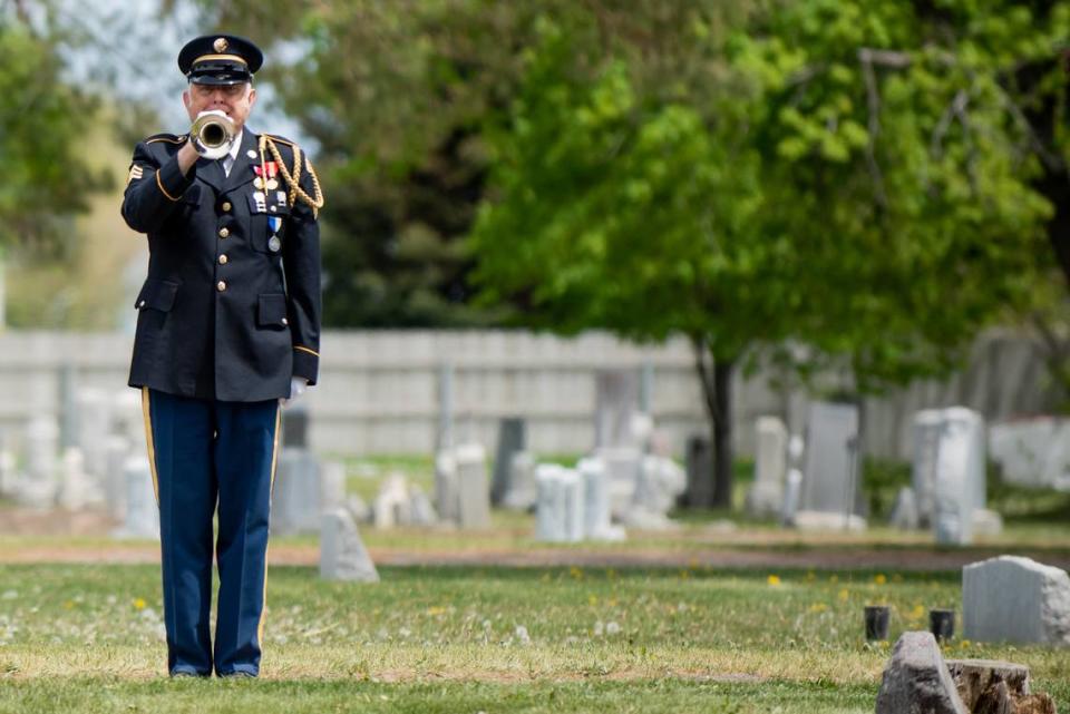 An Idaho National Guard bugler performs Taps at the military funeral for Pfc. Kenneth Bridger, who was killed in the Korean War and whose remains were just recently identified.