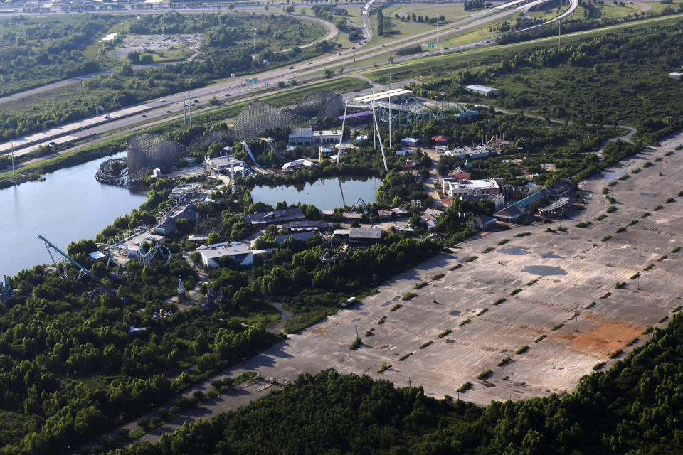 FILE - In this Aug. 27, 2013 file photo, the abandoned Six Flags Great Adventure Amusement Park is seen in New Orleans. The abandoned New Orleans amusement park that has stood empty since Hurricane Katrina in 2005 may finally be torn down. The Six Flags park never reopened after the levees failed and flooded the city with water. Mayor LaToya Cantrell says her office is targeting the site for demolition.(AP Photo/Gerald Herbert, File)