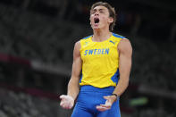 Armand Duplantis, of Sweden, celebrates after winning the gold medal in the men's pole vault final at the 2020 Summer Olympics, Tuesday, Aug. 3, 2021, in Tokyo. (AP Photo/Matthias Schrader)