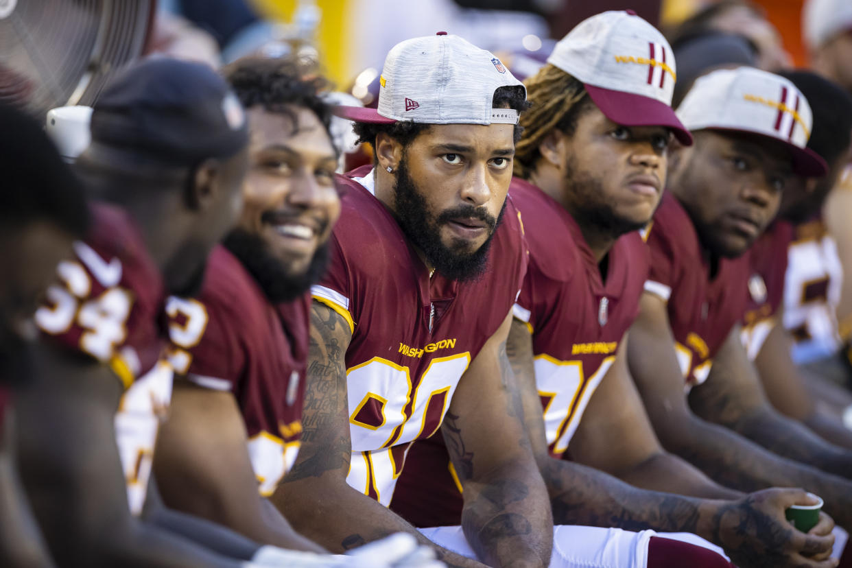 Washington Football Team defensive lineman Montez Sweat (center) has been placed on the reserve/COVID-19 list and is reportedly unvaccinated. (Photo by Scott Taetsch/Getty Images)