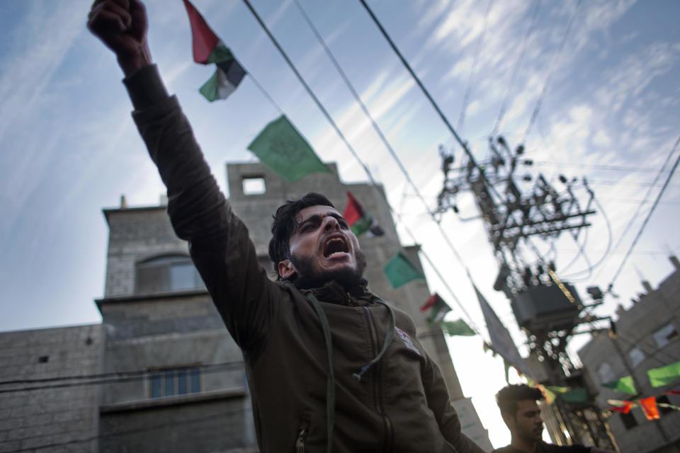 A Palestinian chants slogans during a demonstration against the chronic power cuts in Jabaliya refugee camp, Northern Gaza Strip, Thursday, Jan. 12, 2017. Thousands of people took to the streets on Thursday to protest chronic power cuts in the Hamas-ruled Gaza Strip, in one of the largest unauthorized protests in the territory since the Islamic militant group took power a decade ago. (AP Photo/ Khalil Hamra)