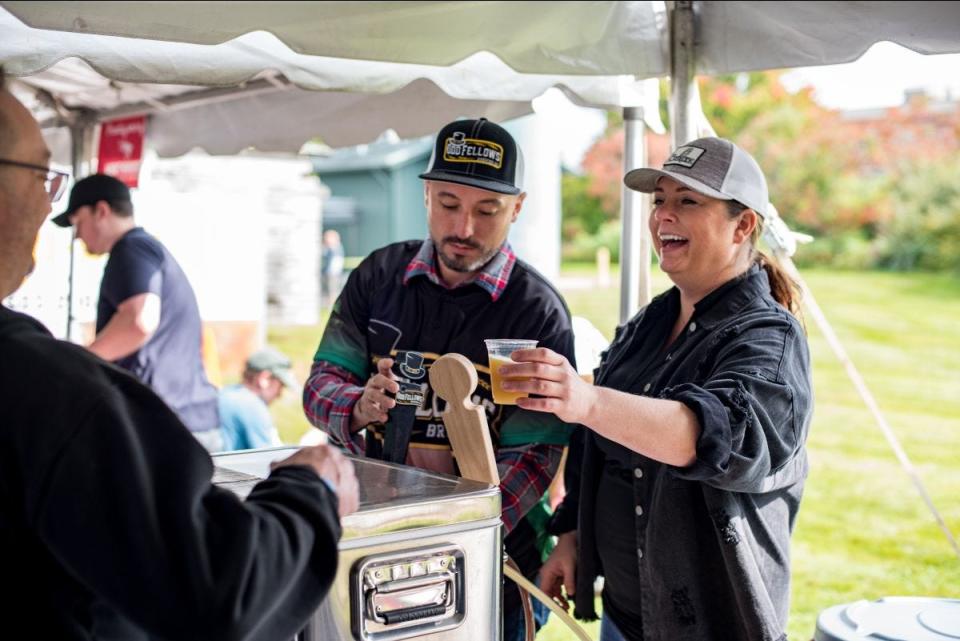 Guests are poured samples at BrewFest 2021.