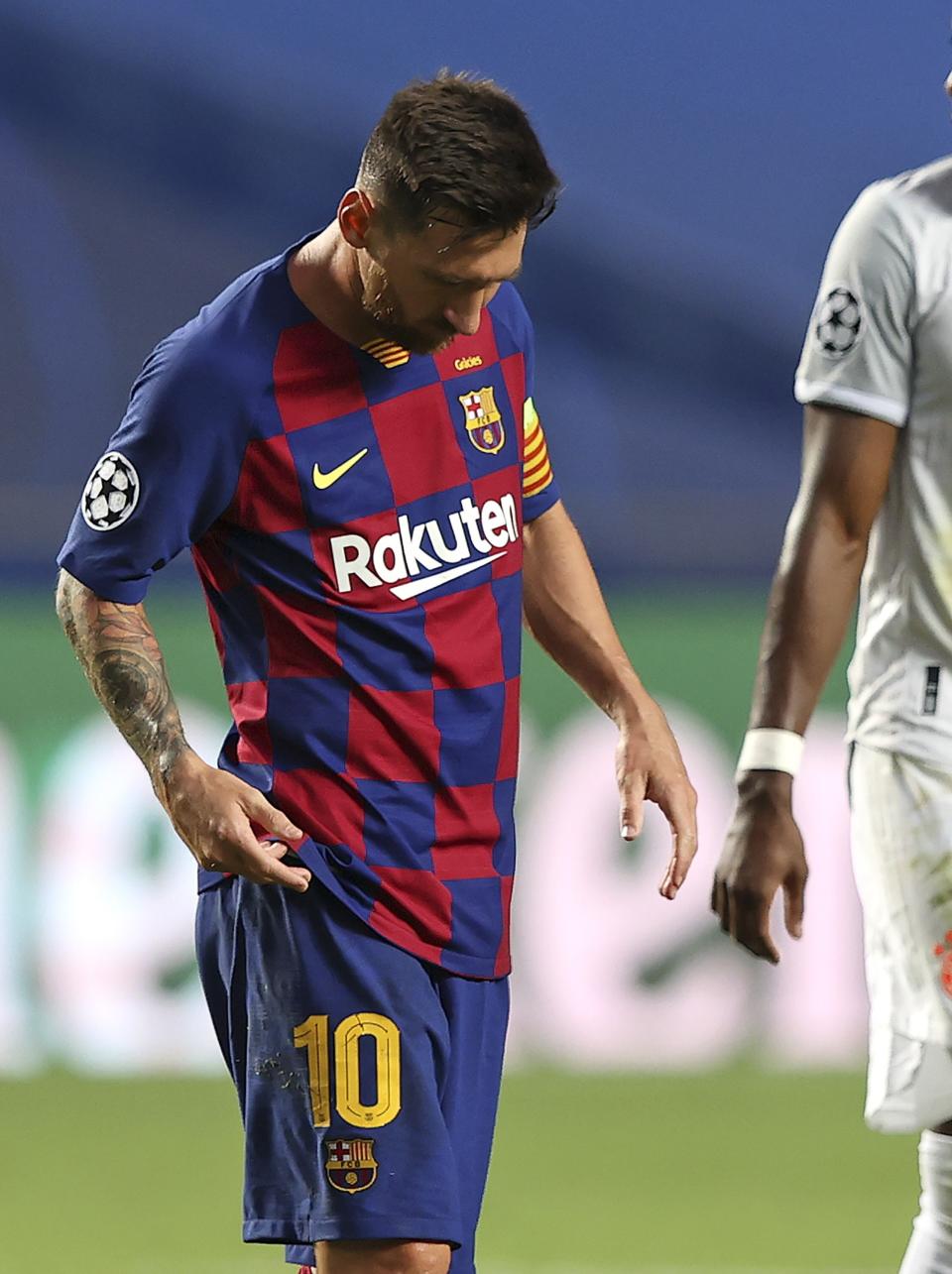 Barcelona's Lionel Messi leaves the pitch at half time during the Champions League quarterfinal soccer match between Barcelona and Bayern Munich in Lisbon, Portugal, Friday, Aug. 14, 2020. (Rafael Marchante/Pool via AP)