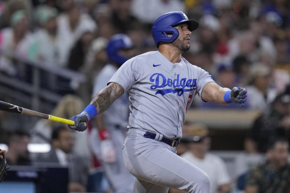 David Peralta hits the Dodgers' ground-rule double in the seventh inning against the San Diego Padres on Friday.