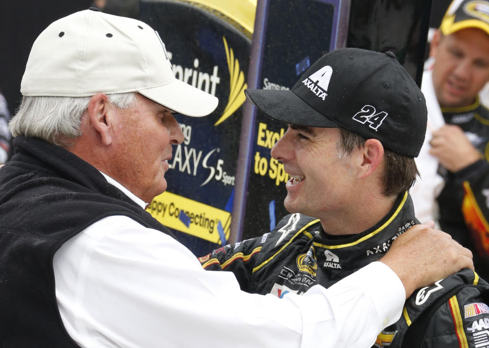 FILE - Jeff Gordon, right, celebrates his victory with team owner Rick Hendrick after the NASCAR Sprint Cup Series Pure Michigan 400 auto race at Michigan International Speedway in Brooklyn, Mich., in this Sunday, Aug. 17, 2014, file photo. Jeff Gordon will leave the Fox Sports booth for a daily role at Hendrick Motorsports as vice chairman ranked second only to majority owner Rick Hendrick. The new job positions the four-time champion and Hall of Famer to eventually succeed Hendrick at the top of NASCAR’s winningest organization. (AP Photo/Bob Brodbeck, File)