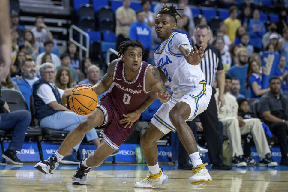 Bellarmine guard Jaylen Fairman, left, drives past UCLA guard Dylan Andrews during the first half of an NCAA college basketball game in Los Angeles, Sunday, Nov. 27, 2022. (AP Photo/Alex Gallardo)