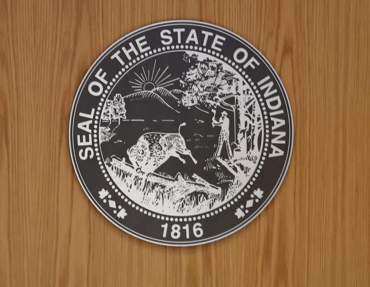 The Indiana state seal marks the bench in a courtroom at the new Marion County Courthouse.