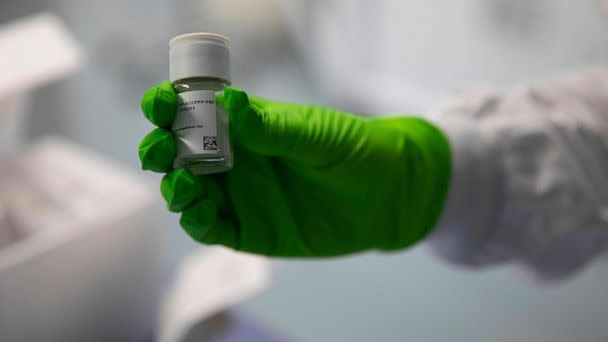 PHOTO: An employee holds up a vial of an oncological product under development, at the BioNTech research institute in Mainz, Rhineland-Palatinate, western Germany, on Oct. 5, 2022. (Andre Pain/AFP via Getty Images)