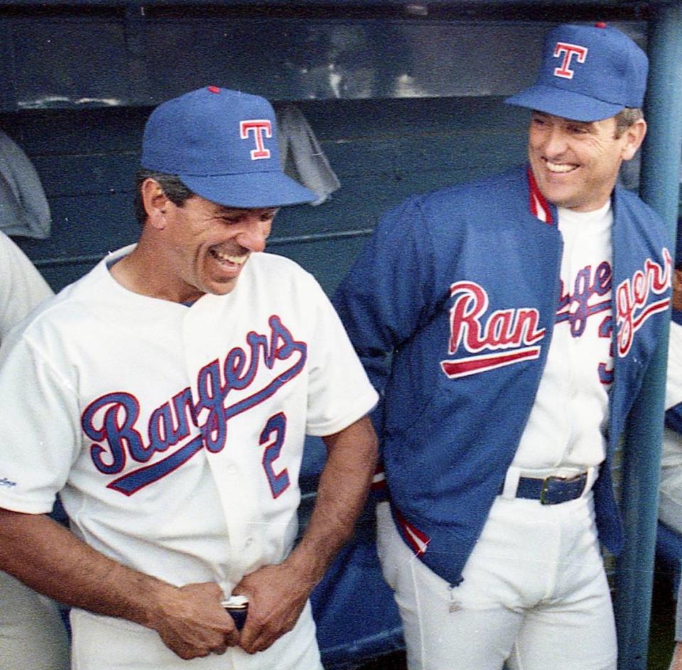 Texas Rangers manager Bobby Valentine, left, and pitcher Nolan Ryan in the dugout in Arlington Stadium before the Rangers played on opening day April 1989.