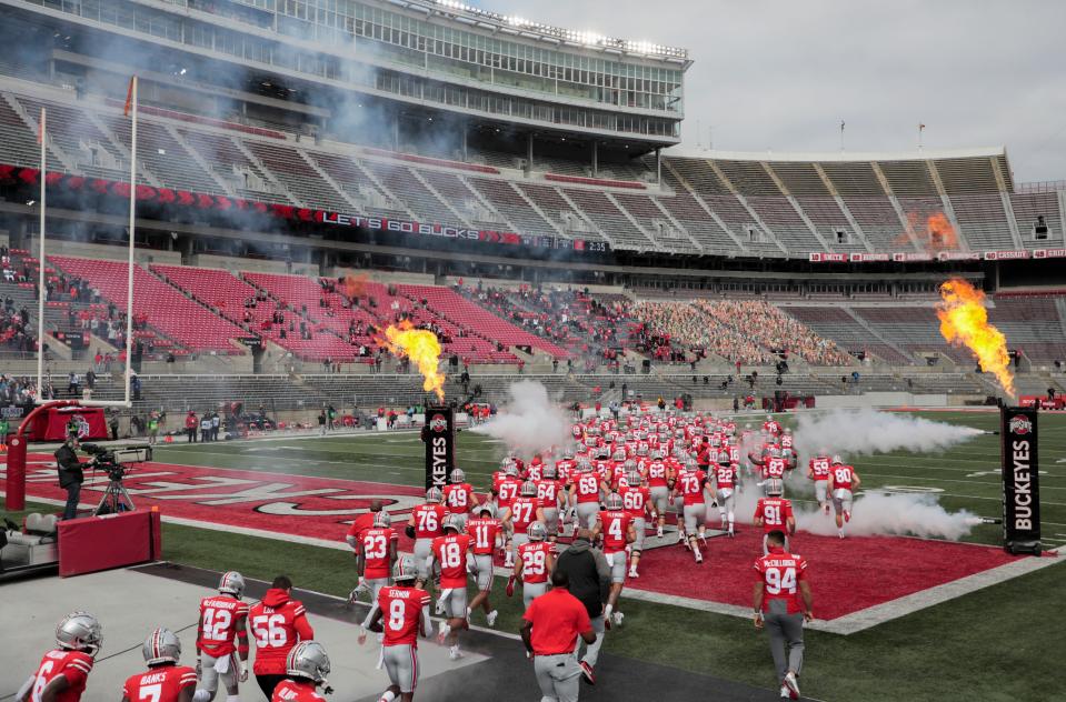 The Ohio State Buckeyes take the field to a nearly empty Ohio Stadium because of COVID-19 restrictions before an NCAA Division I football game between the Ohio State Buckeyes and the Nebraska Cornhuskers on Saturday, Oct. 24, 2020 in Columbus, Ohio.