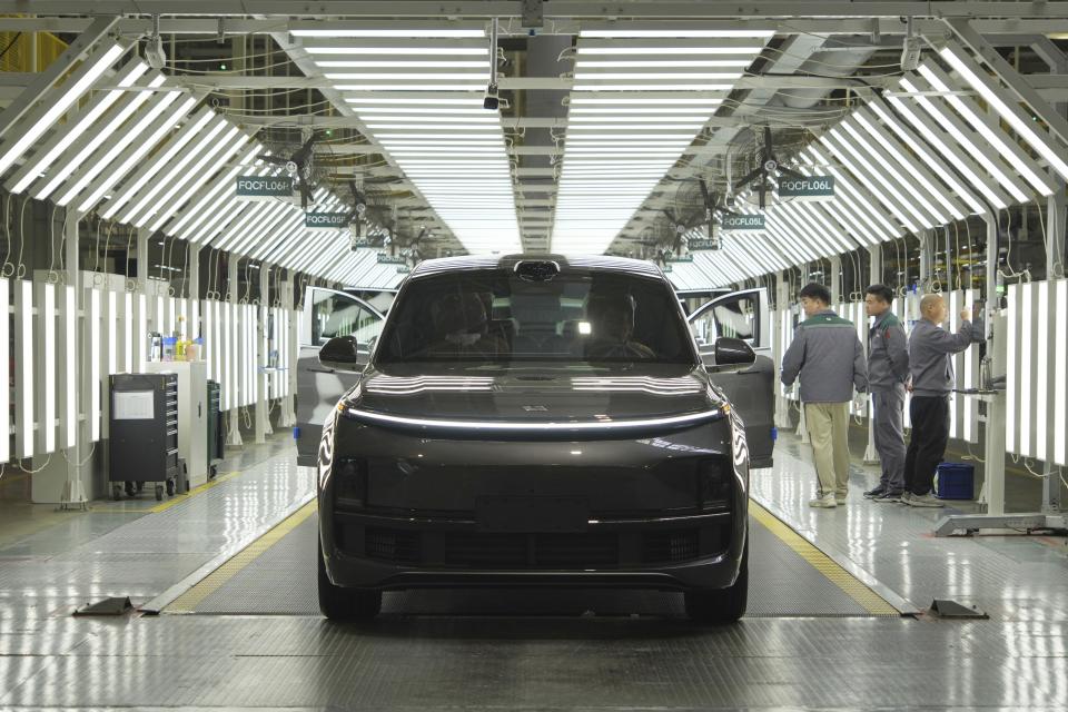An SUV goes through inspection after assembly at a car plant of Li Auto, a major Chinese EV maker, in Changzhou in eastern China's Jiangsu province on Wednesday, March 27, 2024. Manufacturing in China expanded in March after contracting for five consecutive months, according to an official survey of factory managers released Sunday, suggesting a rebound in industrial activities following the Lunar New Year holiday. (Chinatopix Via AP)
