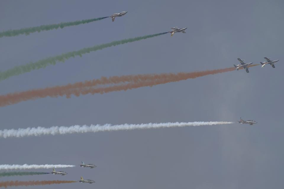Aircraft from the Italian air force's Frecce Tricolori fly at the Dubai Air Show in Dubai, United Arab Emirates, Wednesday, Nov. 15, 2023. (AP Photo/Jon Gambrell)