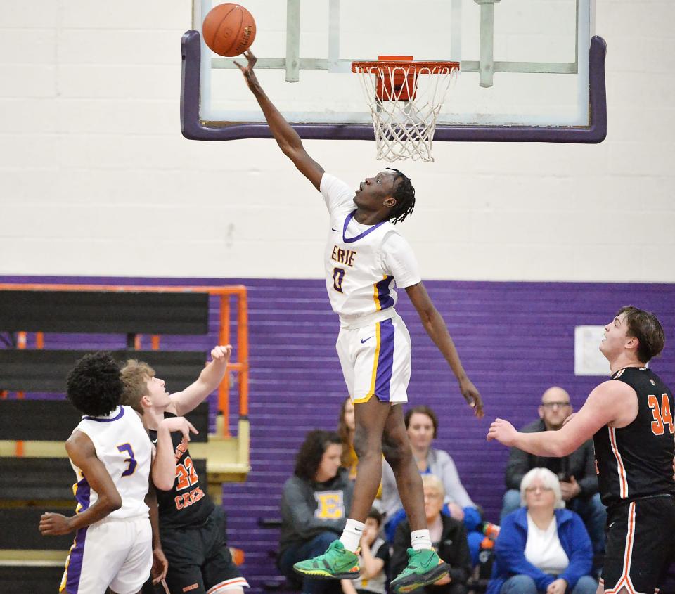 Erie High School's Honest Olango blocks a first-half shot against Harbor Creek in Erie on Friday.