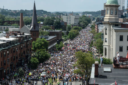 A large crowd of people march towards the Boston Commons to protest the Boston Free Speech Rally in Boston, MA, U.S., August 19, 2017. REUTERS/Stephanie Keith