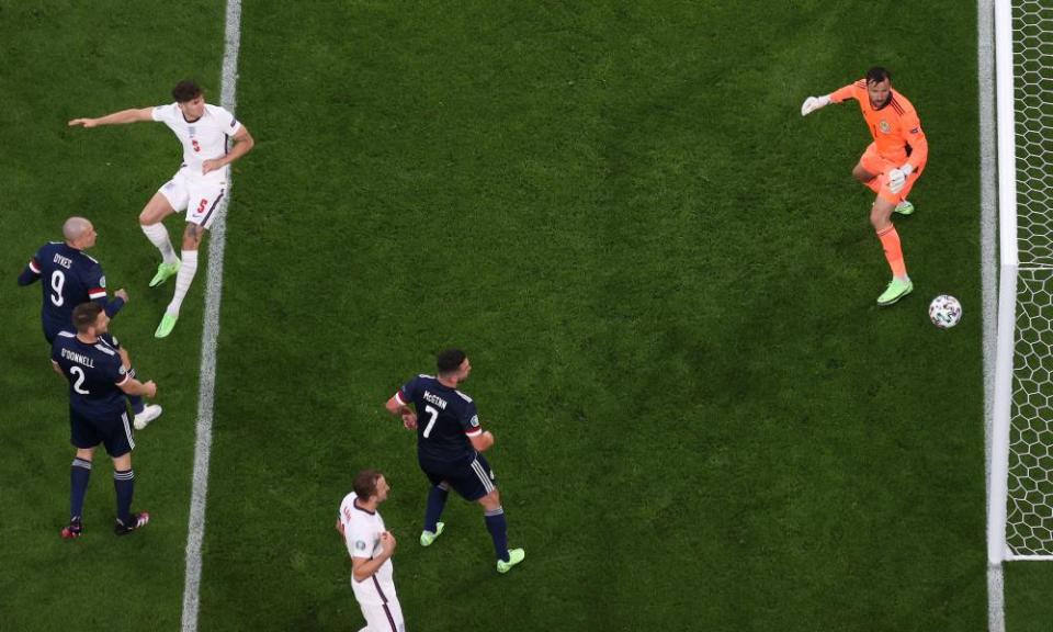 All eyes are on the ball as a header from England’s John Stones hits the upright.