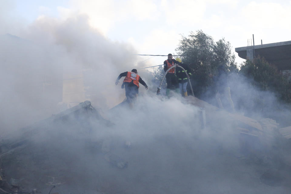 Palestinian emergency services look for survivors after an Israeli strike on a residential building in Rafah, Monday, Feb. 19, 2024. (AP Photo/Hatem Ali)