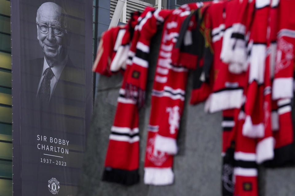 A picture of Sir Bobby Charlton is seen on the stadium, following his death prior the Champions League group A soccer match between Manchester United and Copenhagen at the Old Trafford stadium in Manchester, England, Tuesday, Oct. 24, 2023. Manchester United and England soccer great Bobby Charlton has died at the age of 86. He was an English soccer icon who survived a plane crash that decimated a United team destined for greatness to become the heartbeat of his country's 1966 World Cup-winning team. (AP Photo/Dave Thompson)