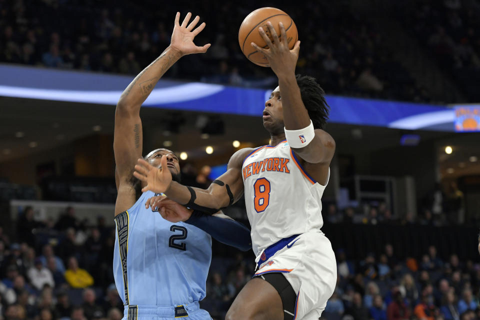 New York Knicks guard DaQuan Jeffries (8) shoots against Memphis Grizzlies forward Xavier Tillman (2) during the first half of an NBA basketball game Saturday, Jan. 13, 2024, in Memphis, Tenn. (AP Photo/Brandon Dill)