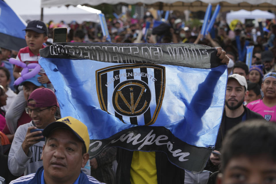 Fans of Independiente del Valle soccer team celebrate winning the Copa Sudamericana 2022 in Quito, Ecuador, Sunday, Oct. 2, 2022. The club trains young men in soccer while providing them with up to a high school graduation and has become a key source for the country’s national soccer team. (AP Photo/Dolores Ochoa)