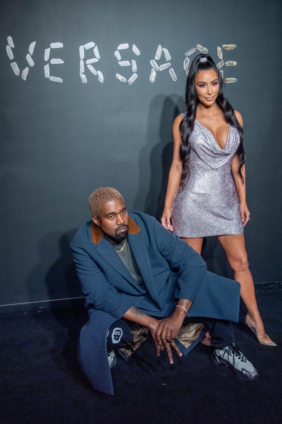 NEW YORK, NEW YORK - DECEMBER 02: Kanye West and Kim Kardashian West attend the the Versace fall 2019 fashion show at the American Stock Exchange Building in lower Manhattan on December 02, 2018 in New York City. (Photo by Roy Rochlin/Getty Images) ORG XMIT: 775265688 ORIG FILE ID: 1076421776