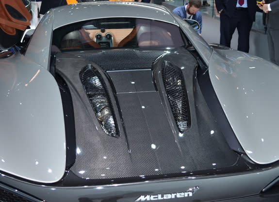 McLaren 570S with rear hood made of carbon fiber composite in transparent finish. It serves the dual purposes of style and light weight.