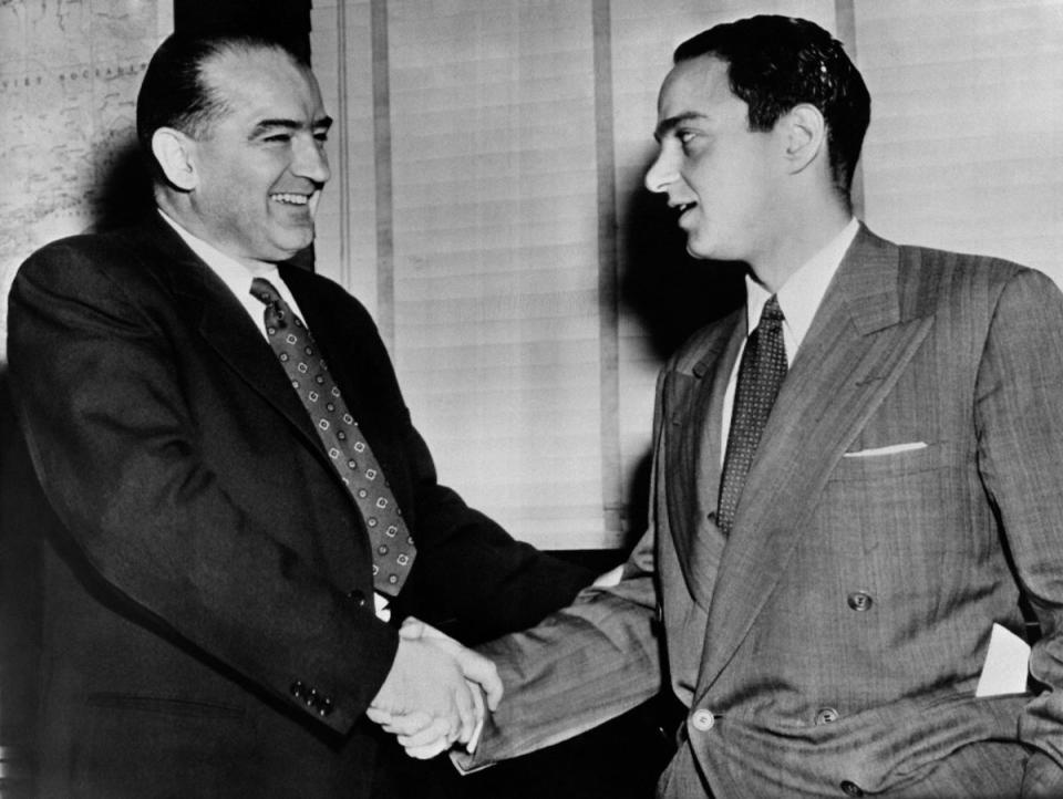 Roy Cohn shakes hands with infamous Sen. Joseph McCarthy; the young and rising New York lawyer served as chief counsel during the infamous anti-Communist hearings and witch-hunts, making him a headline staple (INTERCONTINENTALE/AFP via Getty)