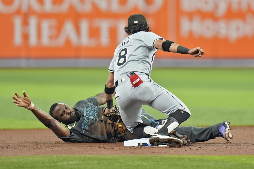 Chicago White Sox second baseman Nicky Lopez (8) tags out Tampa Bay Rays' Randy Arozarena attempting to steal second base during the first inning of a baseball game Tuesday, May 7, 2024, in St. Petersburg, Fla. (AP Photo/Chris O'Meara)