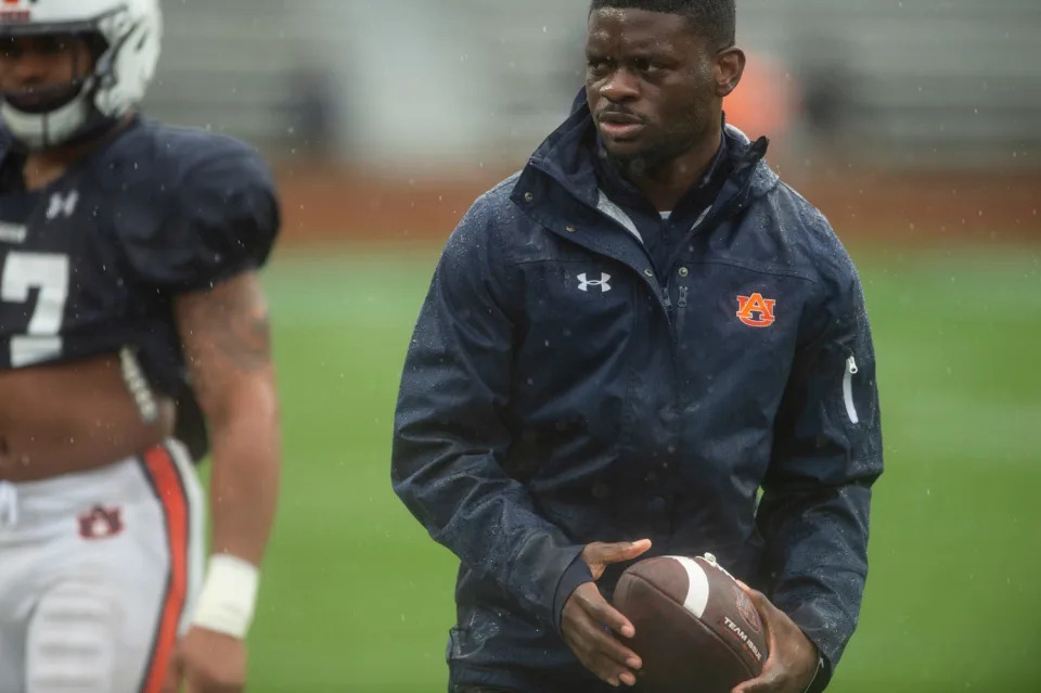 Auburn Tigers wide receivers coach Marcus Davis warms up his players during the A-Day spring football game at Jordan-Hare Stadium in Auburn, Ala., on Saturday, April 8, 2023.