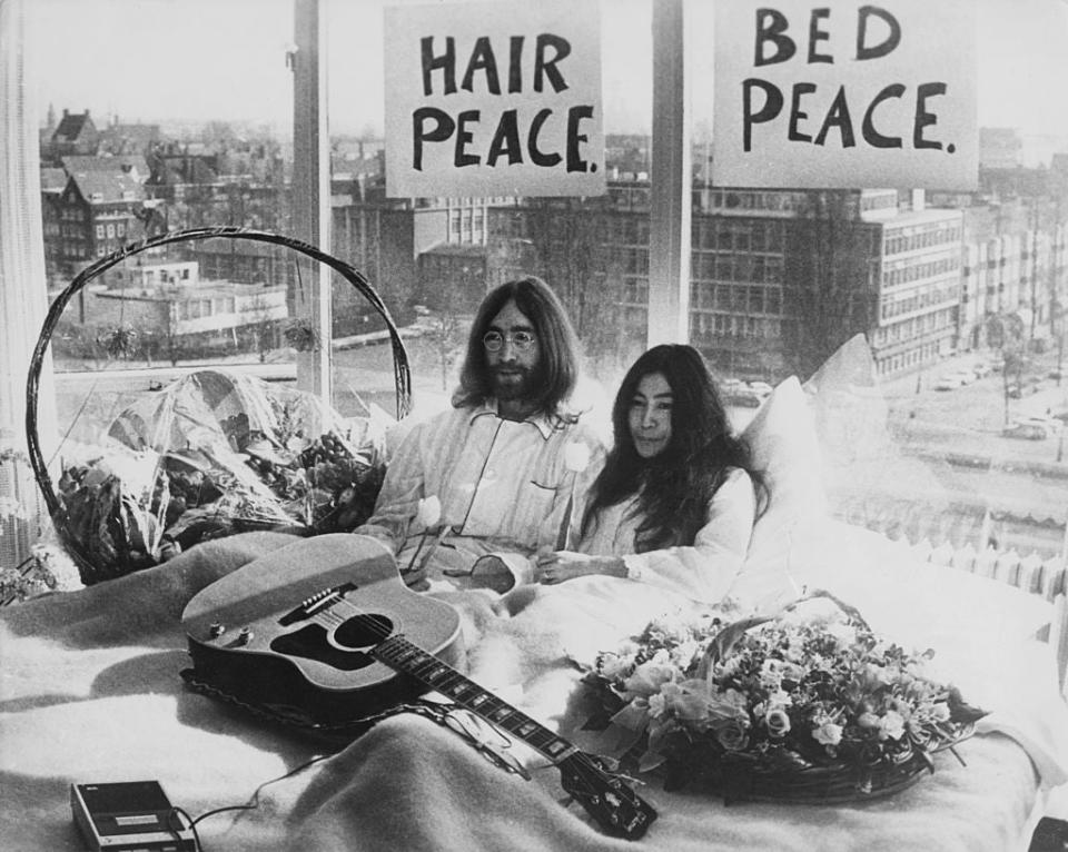 John Lennon and his wife of a week, Yoko Ono, in their bed in the Hilton Hotel, Amsterdam, in 1969Getty