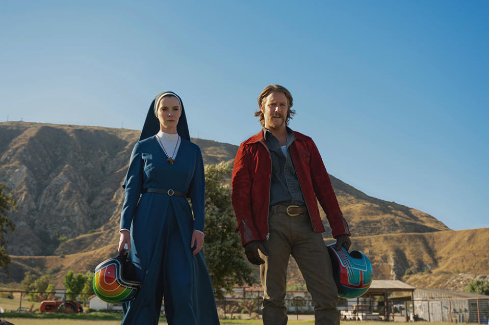 MRS. DAVIS -- "Mother of Mercy: The Call of the Horse" Episode 101 -- Pictured: (l-r) Betty Gilpin as Simone, Jake McDorman as Wiley -- (Photo by: Colleen Hayes/Peacock)