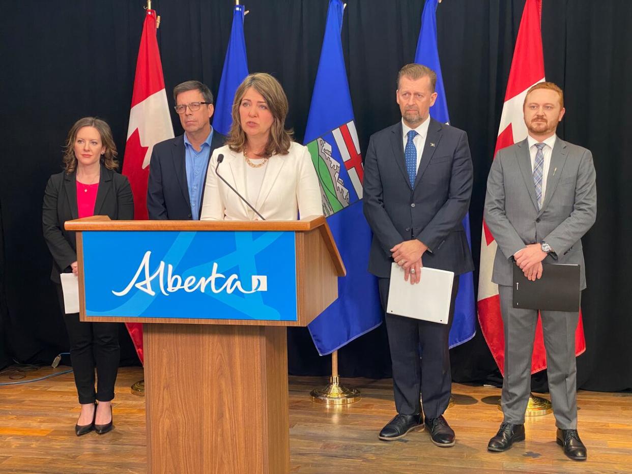 Alberta Premier Danielle Smith, centre, says legal changes are required to allow the provincial government to more quickly respond to natural disasters. Ministers with portfolios included in Bill 21 are, from left: Environment Minister Rebecca Schulz, Forestry and Parks Minister Todd Loewen, Smith, Public Safety and Emergency Services Minister Mike Ellis, and Justice Minister Mickey Amery. (Marc-Antoine LeBlanc - image credit)