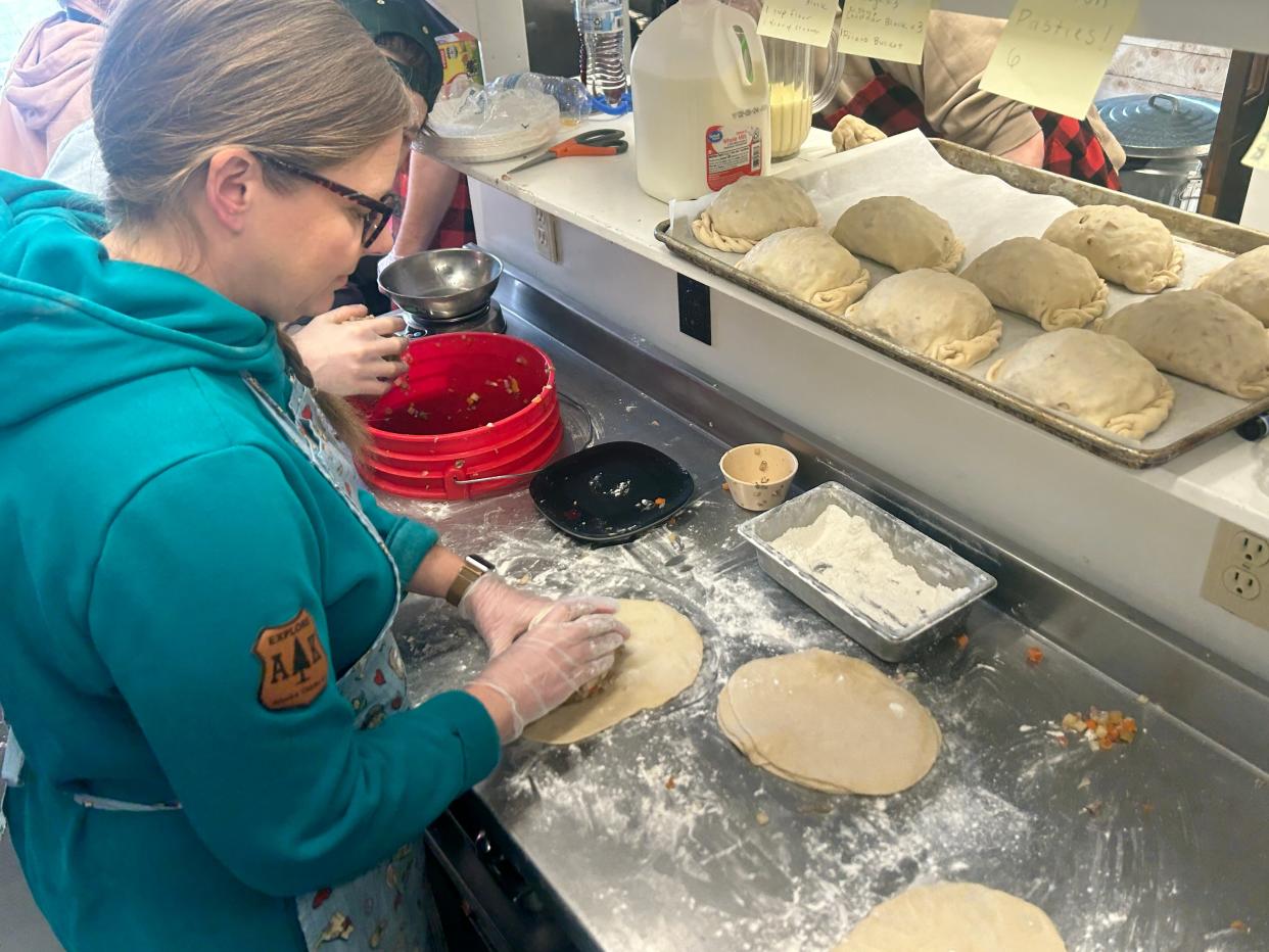 Heidi Ritter of Yooper Pasty Co. making a pasty by hand.
