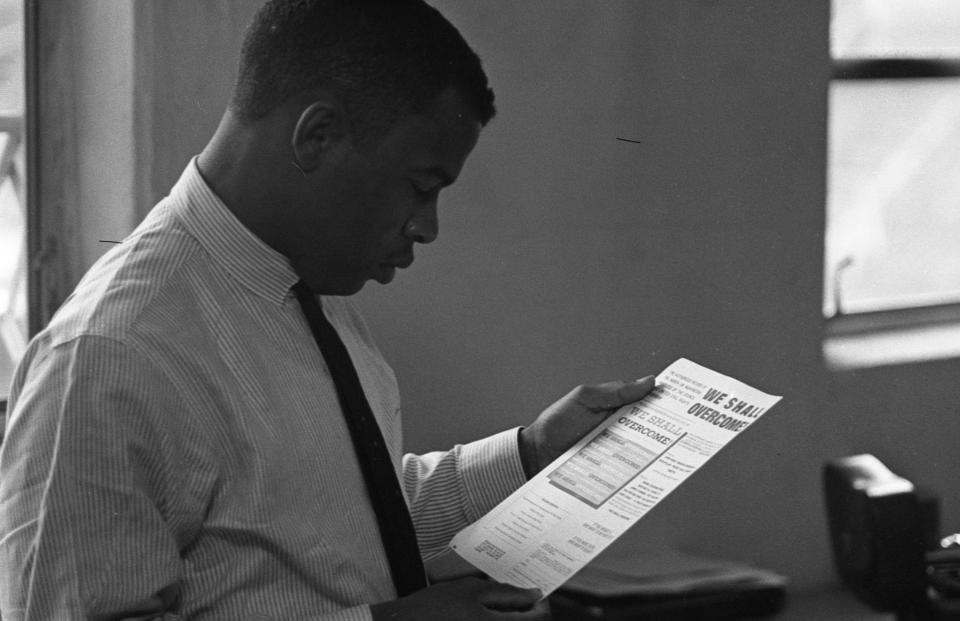 Civil Rights activist (and future politician) John Lewis, chairman of the Student Nonviolent Coordinating Committee (SNCC), in an office, New York, 1964. He reads a document titled "We Shall Overcome; the Authorized Record of the March on Washington Produced by the Council for United Civil Rights Leadership." (Photo: Robert Elfstrom/Villon Films/Getty Images)