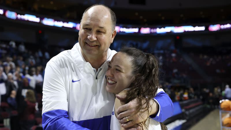 BYU Cougars women’s basketball coach Jeff Judkins hugs BYU Cougars guard Maria Albiero (5) after BYU beat the Portland Pilots in the 2022 WCC Tournament semifinals in Las Vegas on March 7, 2022. Judkins is joining the University of Utah women’s basketball staff as an assistant coach of player development and community ambassador.