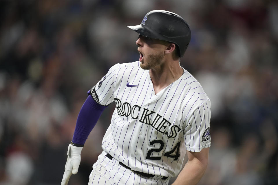 Colorado Rockies' Ryan McMahon turns to the dugout and yells as he heads up the first-base line after hitting a two-run home run off San Diego Padres starting pitcher Yu Darvish during the sixth inning of a baseball game Tuesday, June 15, 2021, in Denver. (AP Photo/David Zalubowski)