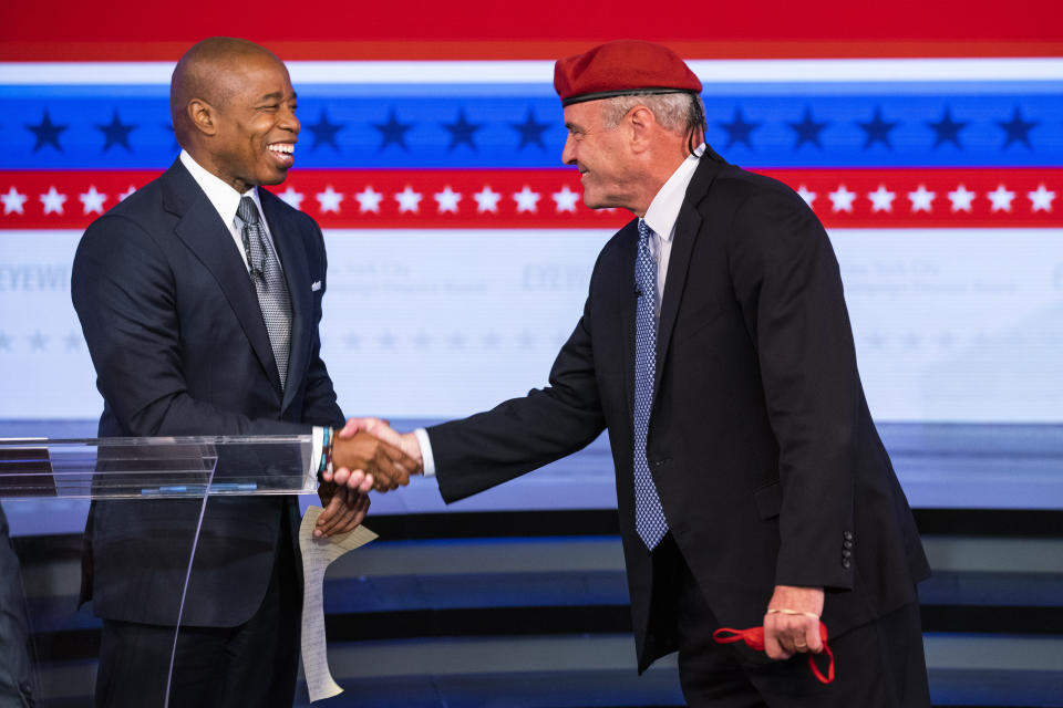 Eric Adams, Brooklyn borough president and Democratic candidate for New York City mayor, left, and Republican mayoral candidate Curtis Sliwa shake hands after participating in a debate at the ABC-7 studios in New York, Tuesday, Oct. 26, 2021. (Eduardo Munoz/Pool Photo via AP)