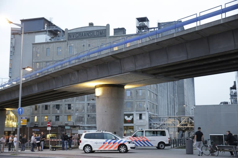 Police evacuate the Maassilo concert hall in Rotterdam after a terror attack threat