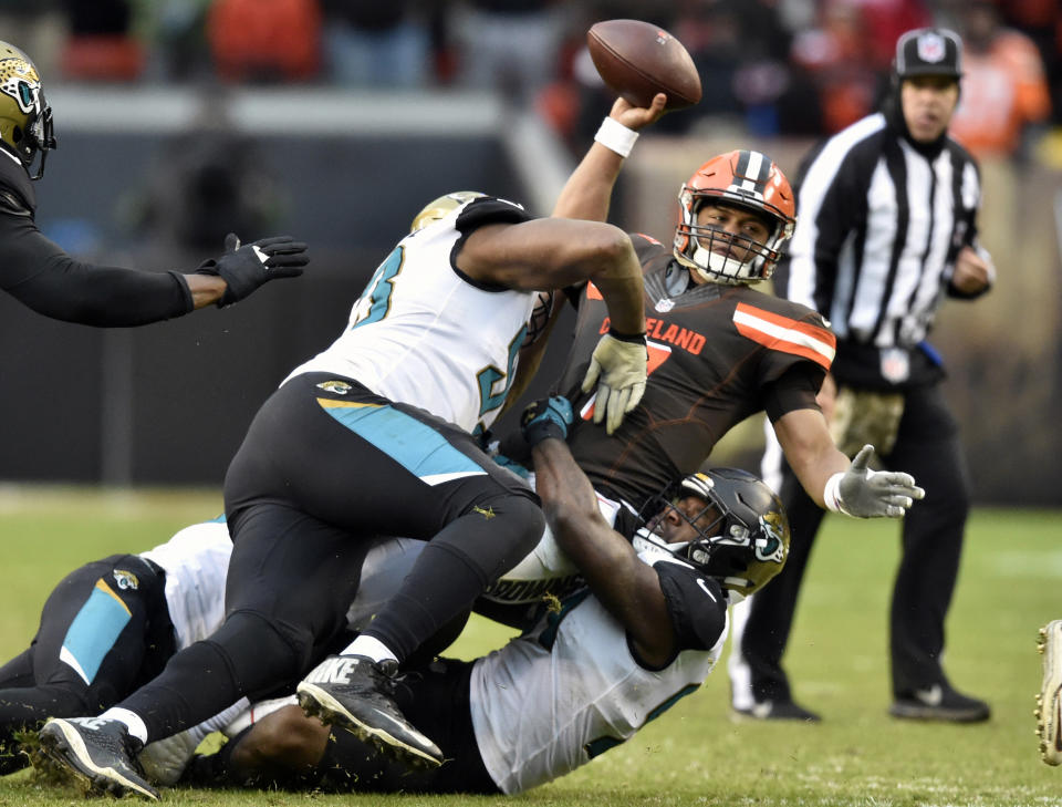 <p>Cleveland Browns quarterback DeShone Kizer (7) is sacked in the second half of an NFL football game against the Jacksonville Jaguars, Sunday, Nov. 19, 2017, in Cleveland. The Jaguars won 19-7. (AP Photo/David Richard) </p>