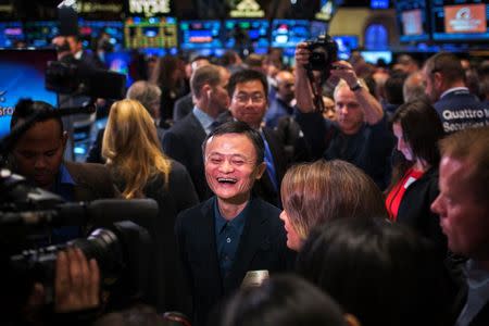 Alibaba Group Holding Ltd. founder Jack Ma reacts on the floor of the New York Stock Exchange before the company's initial public offering (IPO) under the ticker "BABA", in New York September 19, 2014. REUTERS/Brendan McDermid