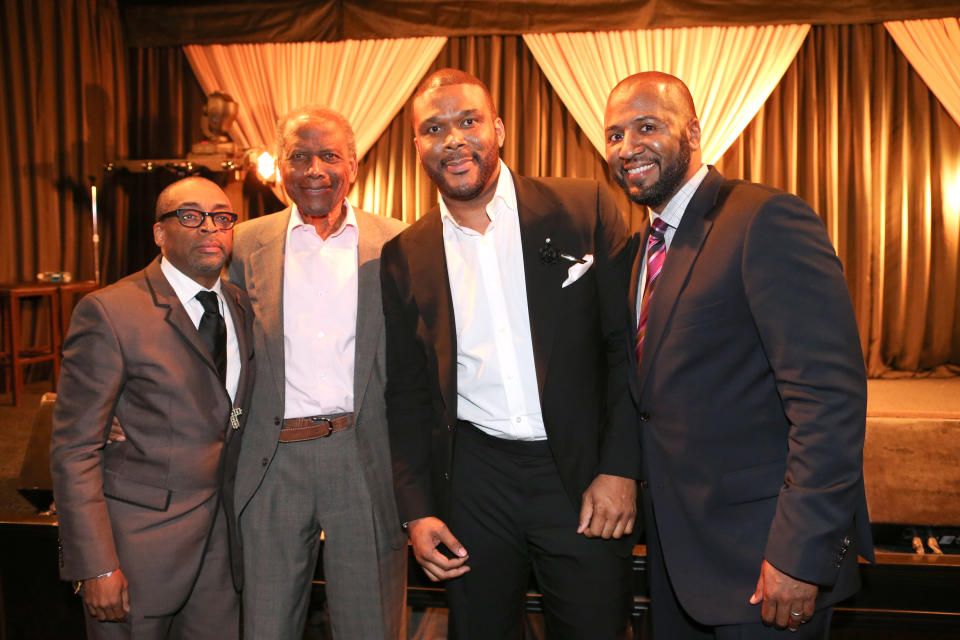 This Feb. 26, 2014 photo released by shows, from left, Spike Lee, Sidney Poitier, Tyler Perry and Malcolm Lee at a ceremony by Essence magazine honoring the achievements of African-American men in Hollywood, in Beverly Hills, Calif. (AP Photo/Essence-Tyler Perry, George Burns)