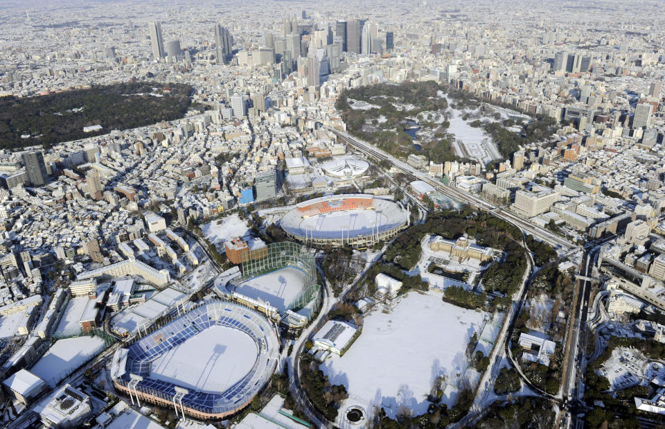 The center of town is still covered with snow in Tokyo Tuesday, Jan. 15, 2013 following Monday's snowfall. In the season's first snowfall in the Japanese capital, about 8 centimeters (3 inches) of snow fell in central Tokyo and around Narita on Monday - a national holiday in Japan. The snow snarled traffic and caused train delays. (AP Photo/Kyodo News) JAPAN OUT, MANDATORY CREDIT, NO LICENSING IN CHINA, HONG KONG, JAPAN, SOUTH KOREA AND FRANCE