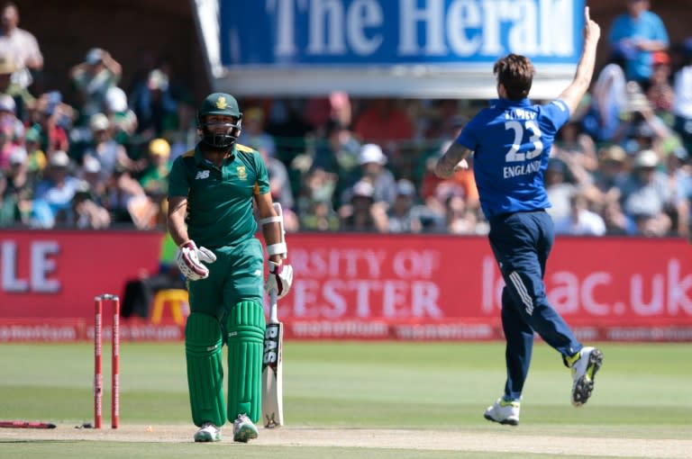 England's bowler Reece Topley (R) celebrates the dismissal of South African batsman Hashim Amla (L) during the second One Day International match between England and S. Africa at St. George's park on February 6, 2016 in Port Elizabeth, South Africa