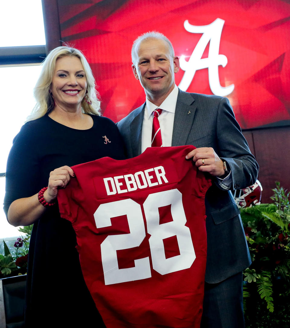 The University of Alabama introduced new head football coach Kalen DeBoer with a press conference at Bryant-Denny Stadium. Nicole and Kalen DeBoer hold up an Alabama jersey after the press conference.