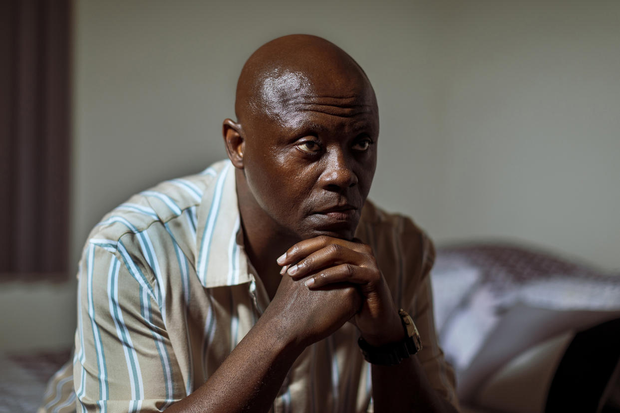 Thomas Raynard James poses for a photograph in his bedroom at his home in Miami, Florida United States, June 24, 2022. (Saul Martinez for NBC News)