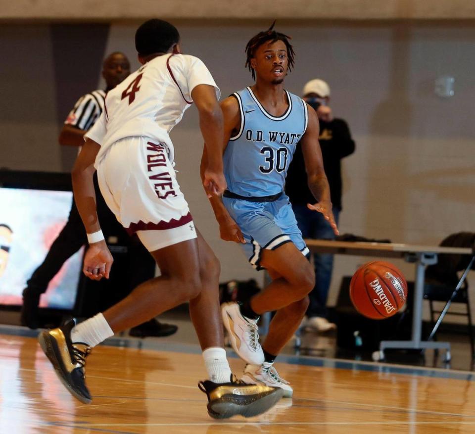 Wyatt guard Kendall Fair (30) brings the ball to the corner defended by Timberview guard Donovan O’Day (4) during the first half of a Division 5A Region 1 quarterfinal basketball game at Arlington ISD Athletics Complex in Arlington, Texas, Saturday, Feb. 27, 2021. O.D. Wyatt led at the half. (Special to the Star-Telegram Bob Booth)