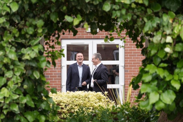 Labour leader Sir Keir Starmer and shadow health secretary Wes Streeting talk together during a visit to Long Lane Surgery in Coalville, a GP practice in the East Midlands 