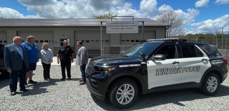 The Raymond DiBattista Charitable Trust has funded a new police cruiser for Windber Borough and a building for the summer day camp program at Windber Recreation Park.  Pictured are, from left to right: Mike Thomas, mayor of Windber Borough; Matt Grohal, recreation director at Windber Recreation Park; Elizabeth Jerley, trustee; Windber Police Chief Andrew Frear and Barry Jerley, trustee.