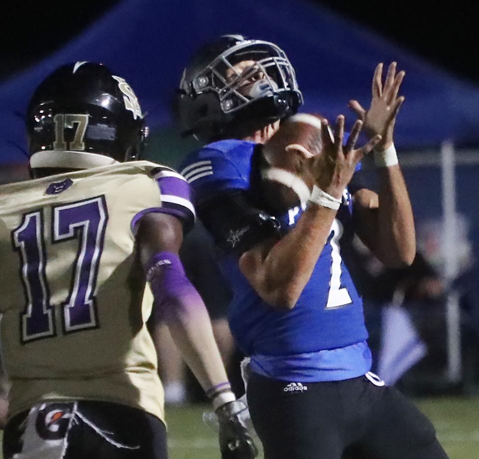 Matanzas' Jordan Mills (2) catches a punt as Winter Springs' Marvin Collins (17) covers, Friday, Nov. 3, 2023.