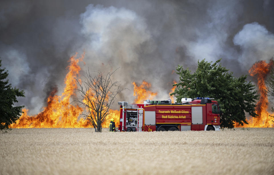 A field in an onshore wind farm is on fire near the town of Zoerbig, eastern Germany, Saturday, July 15, 2023. (Hannes P. Albert/dpa via AP)